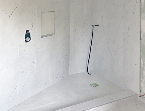 Modern Shower featuring White Stone Walls with Matching Stone Floor