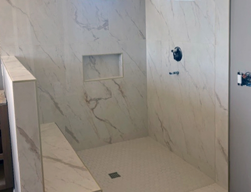 Shower Tile Design featuring Marble Tile, Bench Seat and Inset Detail
